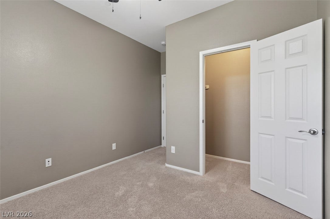 1146 Jesse Harbor Avenue, Henderson, NV 89014 A well-maintained bedroom offers comfort and a generous closet space.