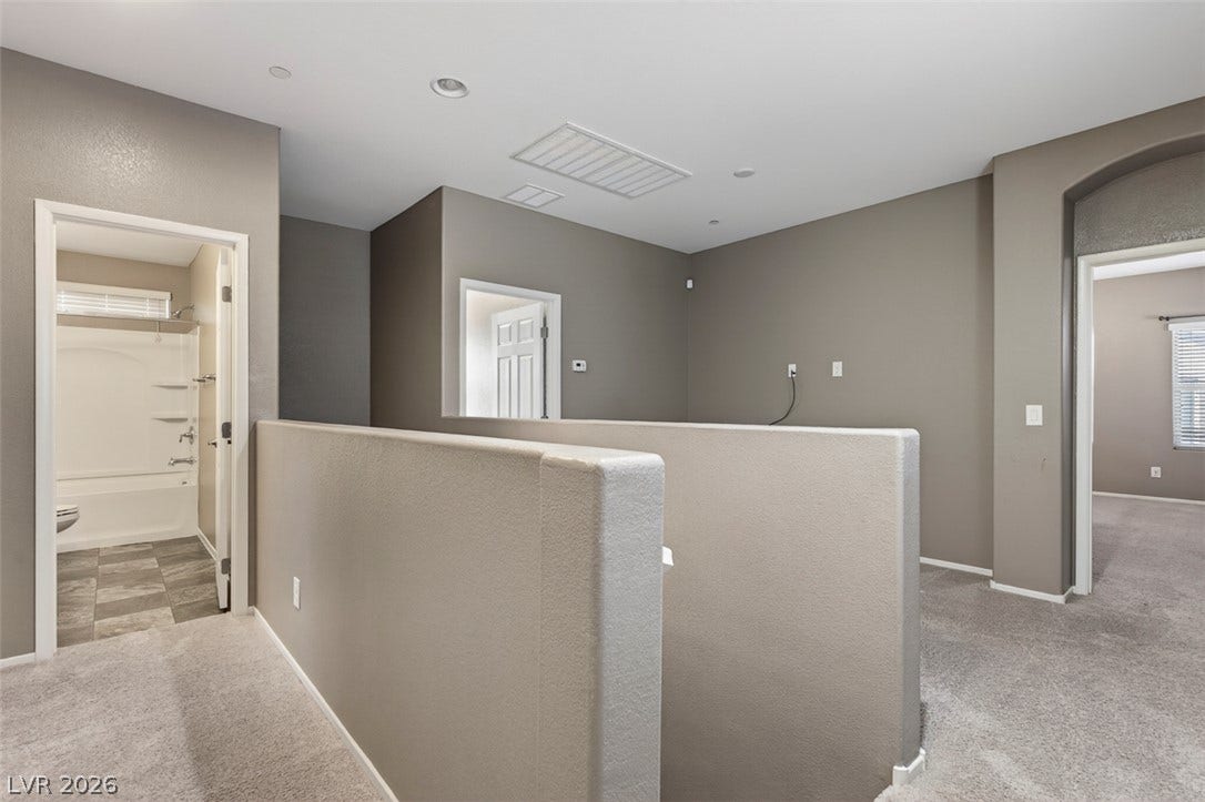 1146 Jesse Harbor Avenue, Henderson, NV 89014 A well-lit landing provides access to a bathroom with a tub/shower combination and another spacious room.