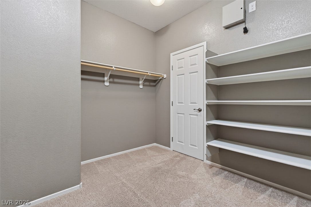 1146 Jesse Harbor Avenue, Henderson, NV 89014 Ample storage solutions abound in this well-appointed closet, featuring extensive shelving and a convenient hanging rod.