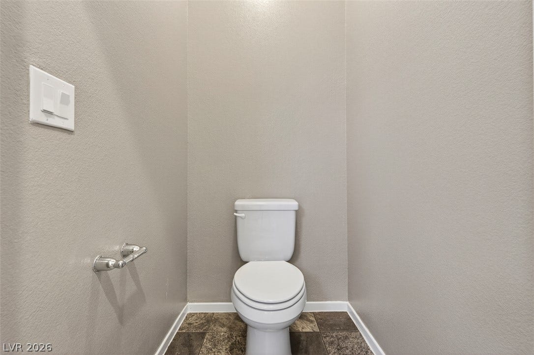 1146 Jesse Harbor Avenue, Henderson, NV 89014 A well-appointed lavatory with durable tile flooring and clean lines awaits.