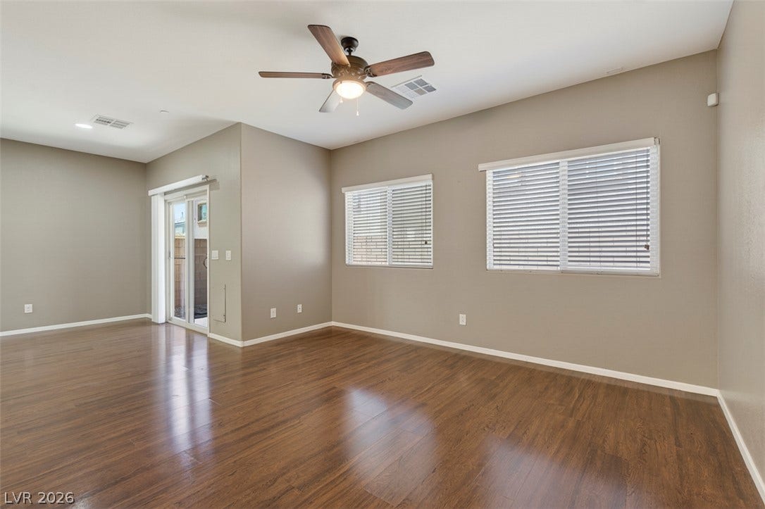 1146 Jesse Harbor Avenue, Henderson, NV 89014 Hardwood floors and ample natural light define this inviting, open-concept living space.