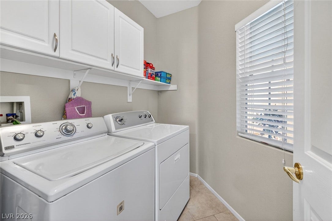 4467 Verdiccio Avenue, Las Vegas, NV 89141 A separate utility room features white cabinetry. Washer & Dryer included.