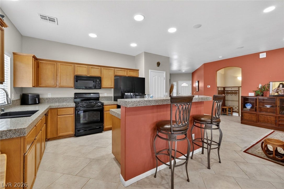 4467 Verdiccio Avenue, Las Vegas, NV 89141 Kitchen features a breakfast bar, ample cabinetry, and GE Appliances.