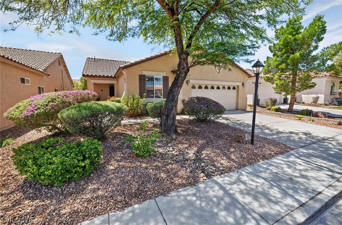 4467 Verdiccio Avenue, Las Vegas, NV 89141 A neatly maintained desert-landscaped yard frames this charming single-story residence.