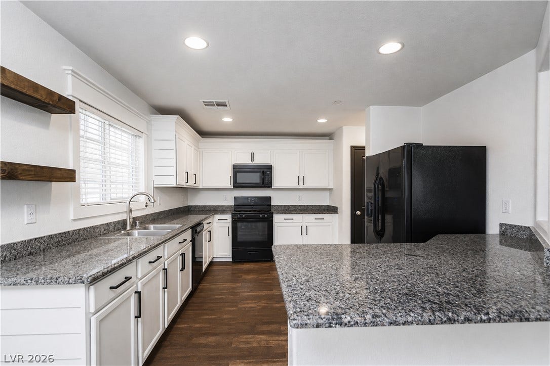 989 Harbor Avenue, Henderson, NV 89002 Kitchen features bright white cabinetry and rich granite countertops