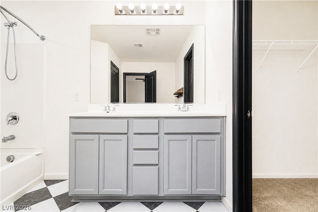 989 Harbor Avenue, Henderson, NV 89002 Double vanity and a full-sized mirror create an optimal daily routine space.