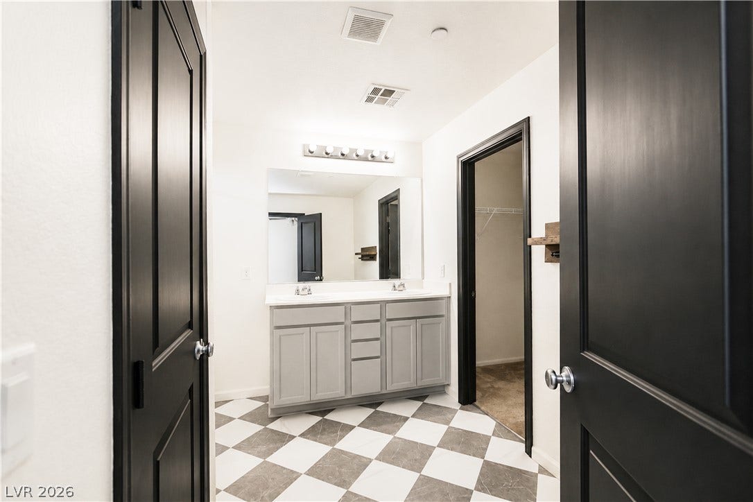 989 Harbor Avenue, Henderson, NV 89002 Double vanity with ample counter space and checkered flooring creates a unique aesthetic.