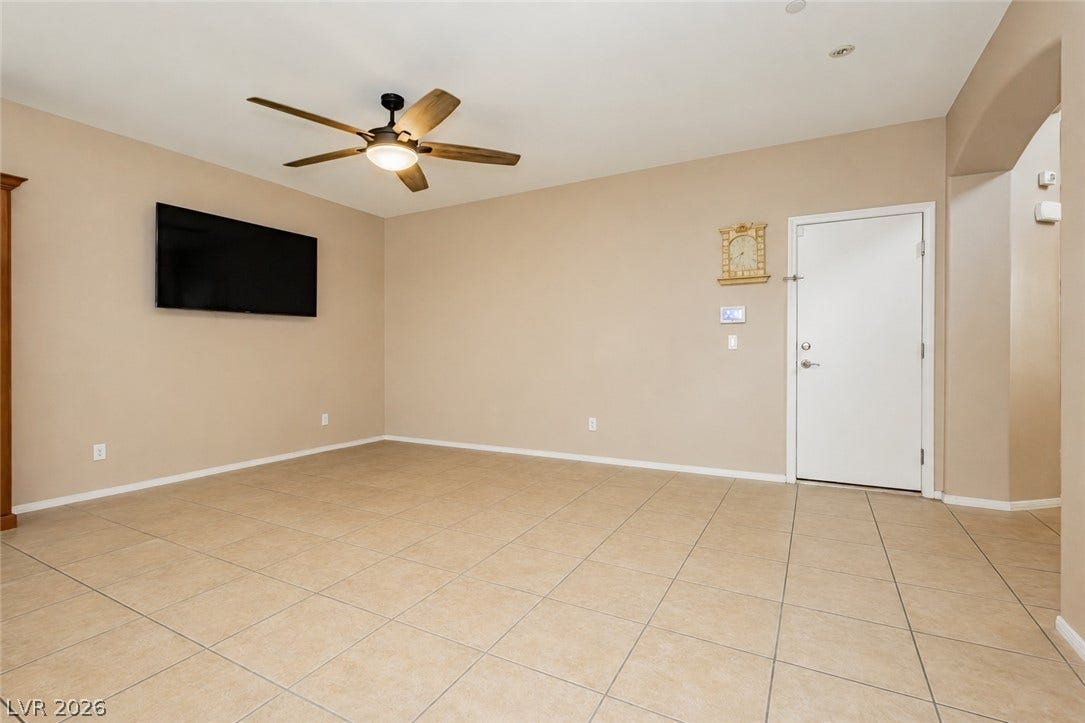 1176 Via Piazza, Henderson, NV 89052 A living space offers cool tile flooring and a ceiling fan, perfect for comfortable daily living.