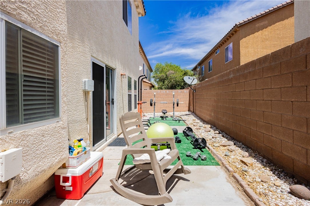1176 Via Piazza, Henderson, NV 89052 A private outdoor space features a compact fitness area, ideal for personal workouts.