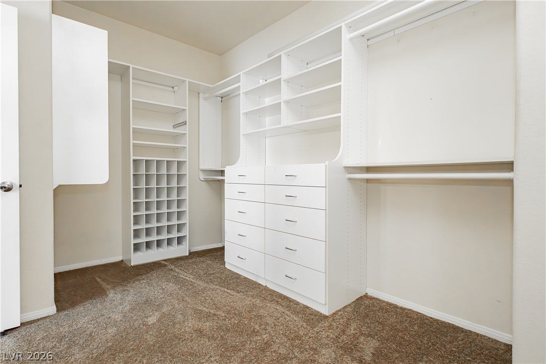 1176 Via Piazza, Henderson, NV 89052 Ample built-in shelving and drawers create an organized and spacious wardrobe.