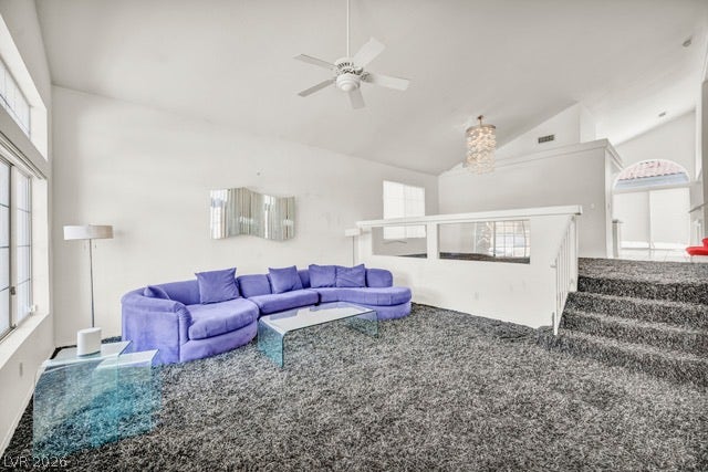 2553 Hummingbird Hill Avenue, Henderson, NV 89074 A spacious common area with vaulted ceilings features plush carpet and an elegant chandelier.