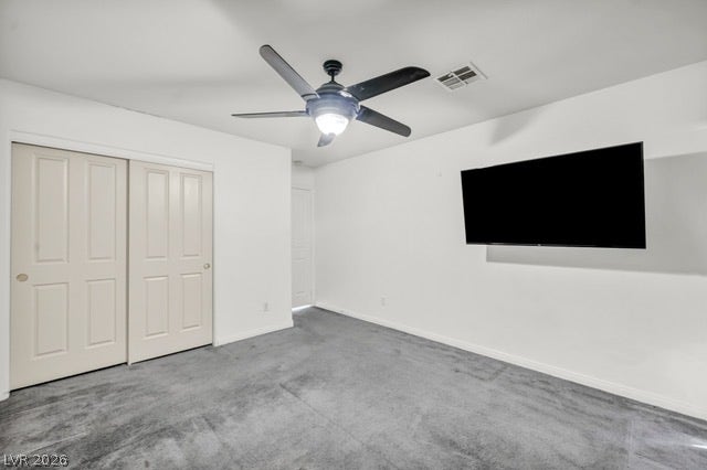 2553 Hummingbird Hill Avenue, Henderson, NV 89074 A quiet bedroom featuring practical sliding closet doors and a ceiling fan for comfort.