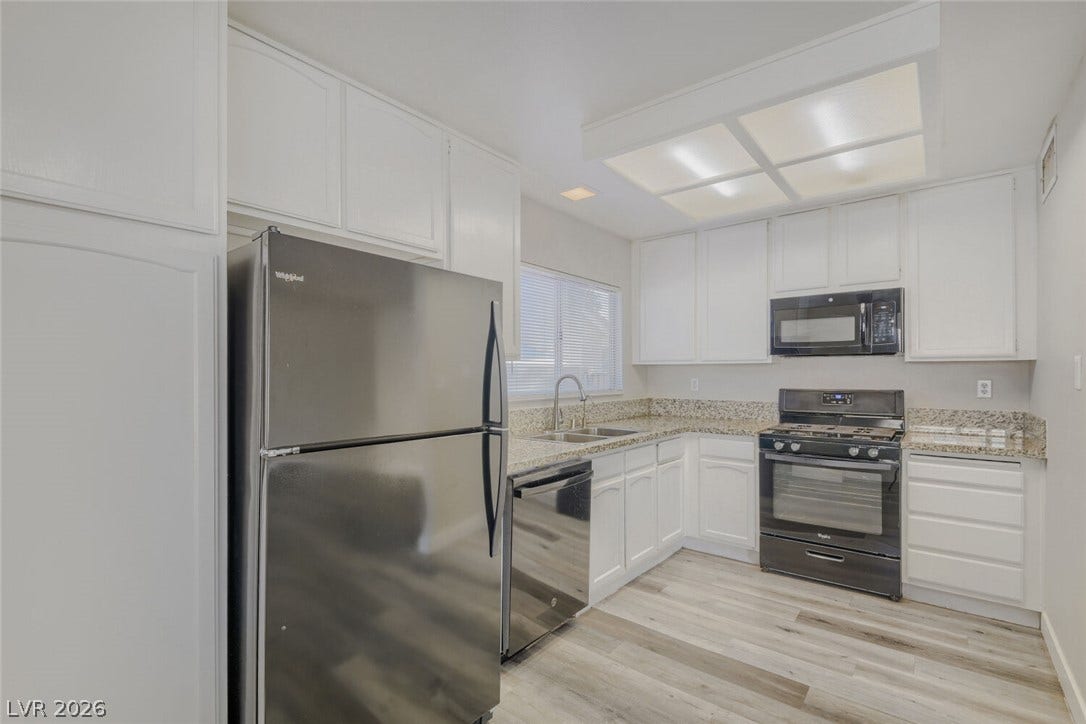 2343 Valleywood Road, Henderson, NV 89014 Culinary delights await in this bright kitchen, complete with ample counter space and modern appliances.