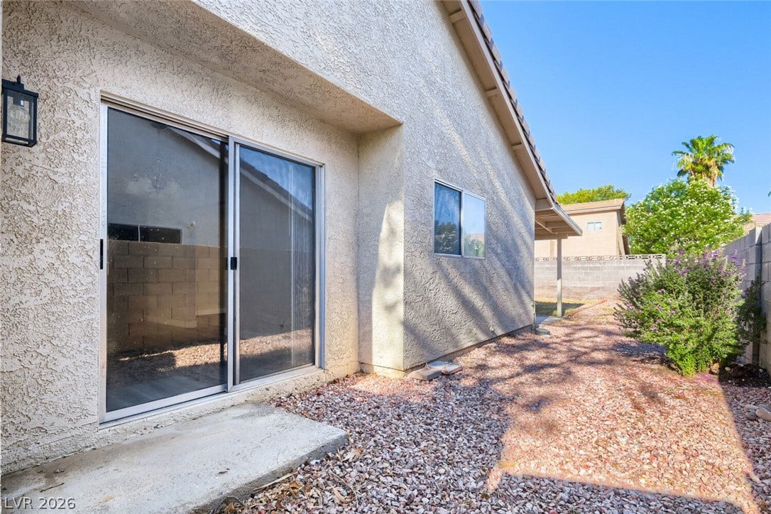 2343 Valleywood Road, Henderson, NV 89014 A private backyard retreat featuring a sliding glass door and low-maintenance landscaping.