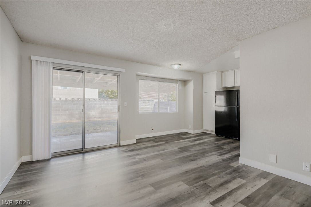 2343 Valleywood Road, Henderson, NV 89014 An open-concept living area boasts durable vinyl plank flooring and abundant natural light.