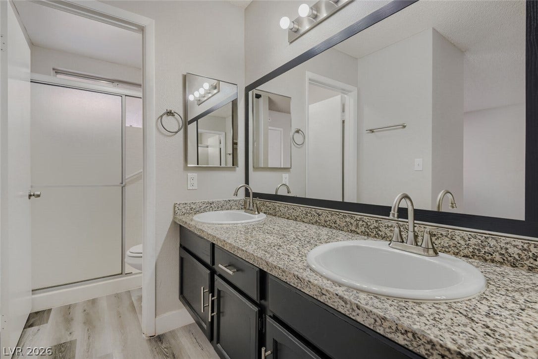 2343 Valleywood Road, Henderson, NV 89014 Two individual sinks provide ample space for daily routines in this well-appointed bathroom.