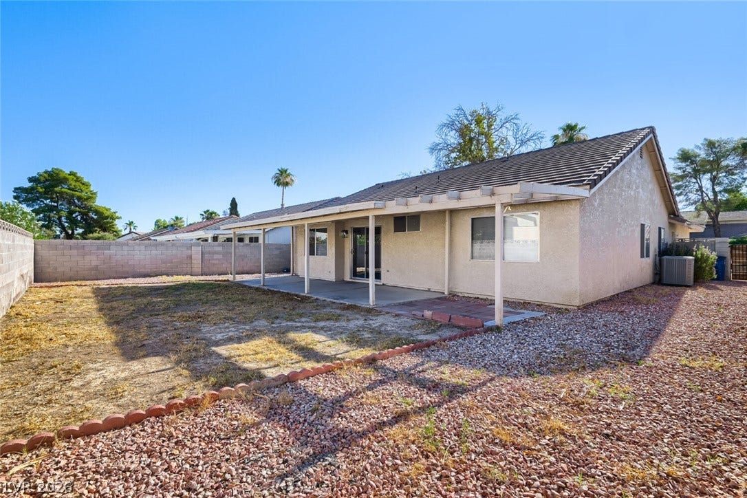 2343 Valleywood Road, Henderson, NV 89014 A spacious backyard awaits, featuring a covered patio and low-maintenance landscaping.