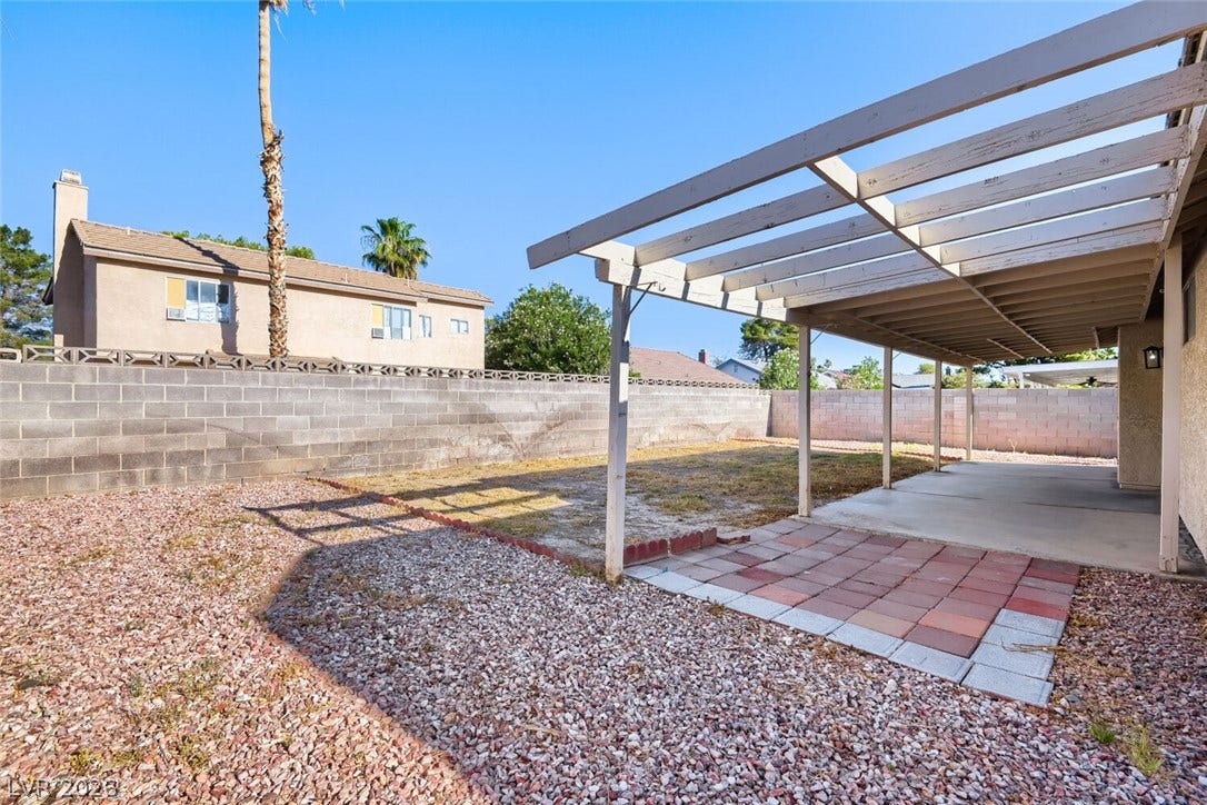 2343 Valleywood Road, Henderson, NV 89014 An inviting covered patio and spacious backyard offer ample room for outdoor activities.