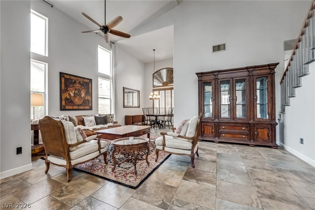 2393 Stansbury Court, Henderson, NV 89052 Lofty ceilings complement the living space, flowing into a well-appointed dining area.