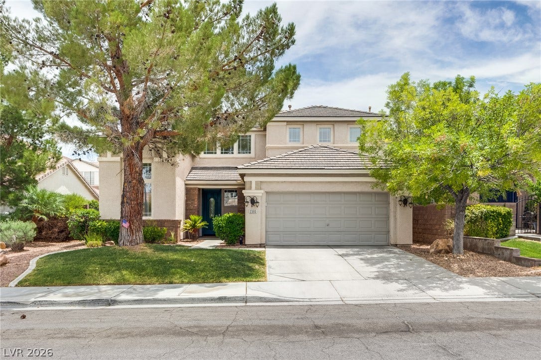 2393 Stansbury Court, Henderson, NV 89052 A well-maintained facade with mature landscaping and a welcoming entry defines this charming residence.
