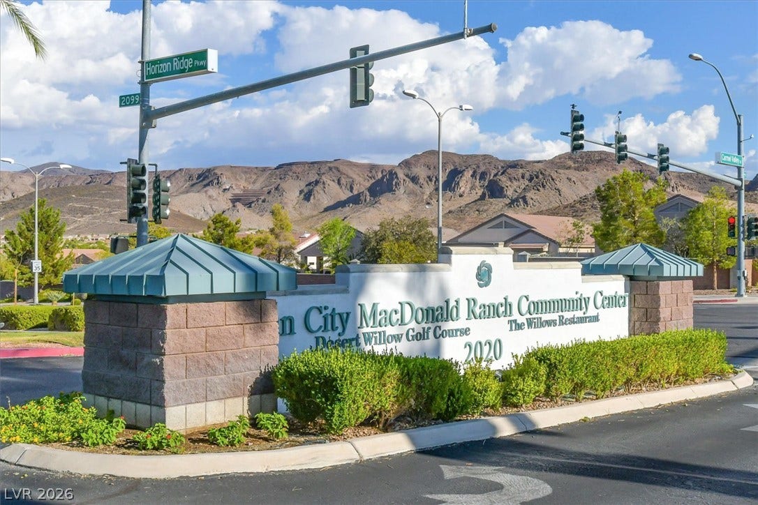 468 Bonnie Brook Place, Henderson, NV 89012 An inviting entrance welcomes residents to a vibrant community set against a backdrop of majestic mountains.