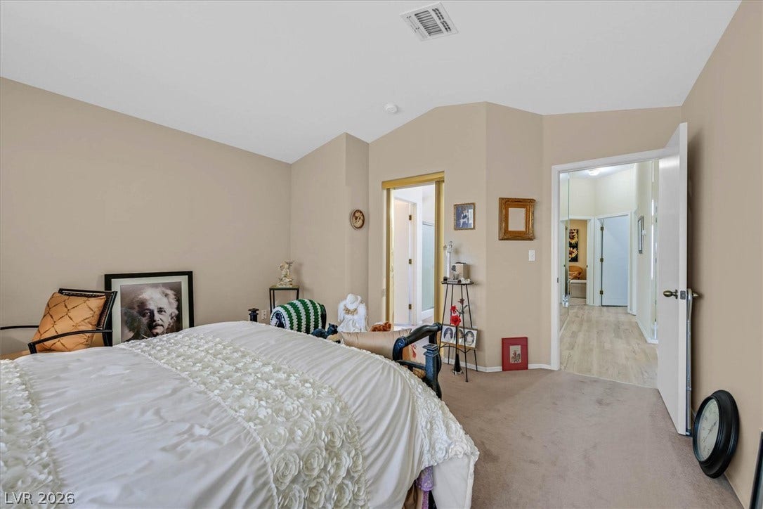 468 Bonnie Brook Place, Henderson, NV 89012 A well-proportioned bedroom offers direct access to a private bathroom, ensuring convenience and comfort.