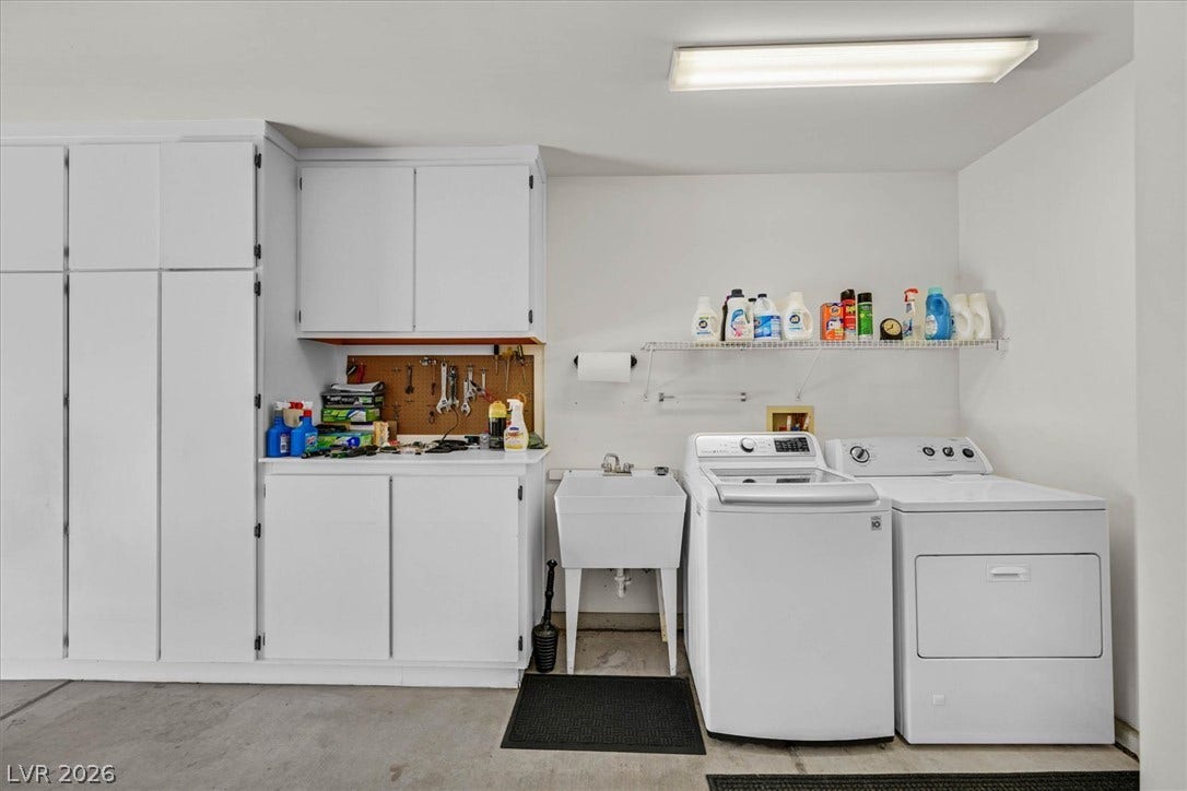 468 Bonnie Brook Place, Henderson, NV 89012 Functional laundry space featuring a utility sink and integrated storage solutions.