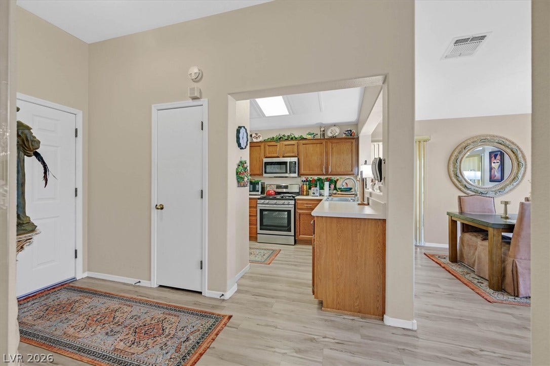 468 Bonnie Brook Place, Henderson, NV 89012 A well-appointed kitchen features a new microwave and stainless steel appliances.
