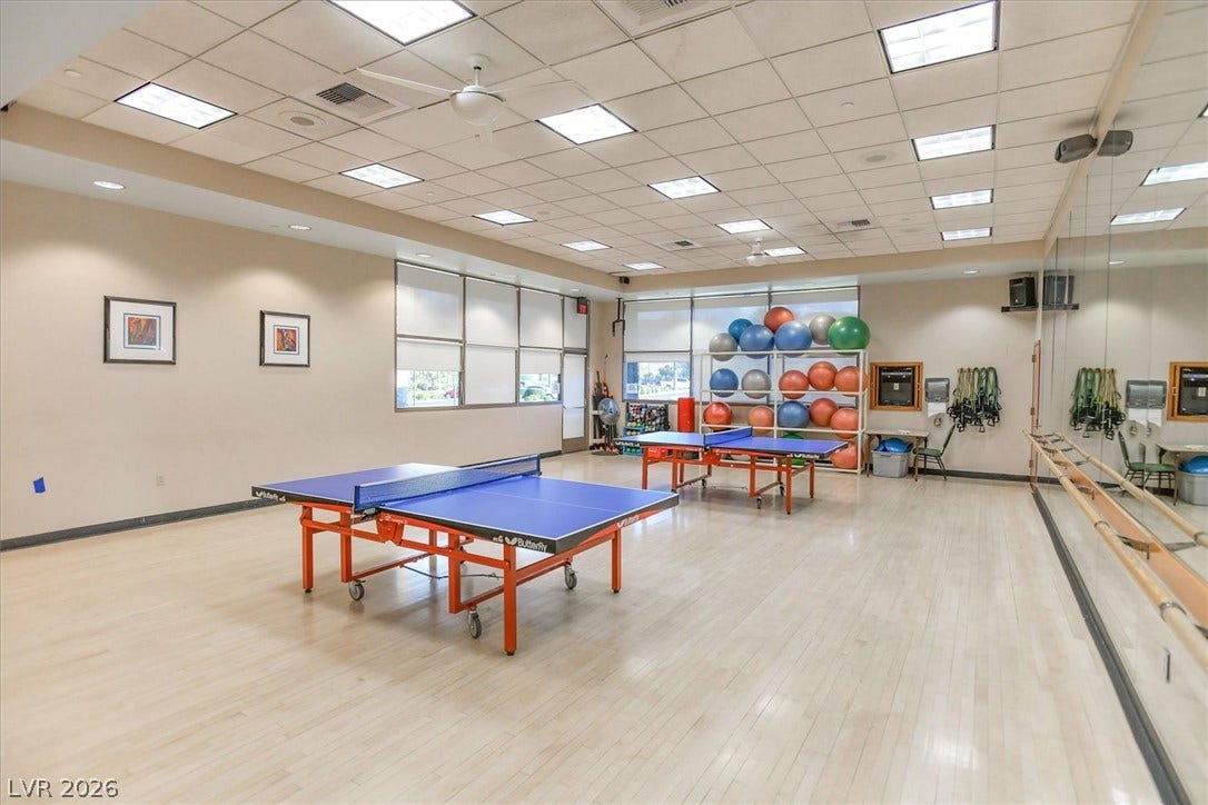468 Bonnie Brook Place, Henderson, NV 89012 A dynamic recreation room featuring table tennis, ballet bar, and fitness equipment, ideal for active pursuits.