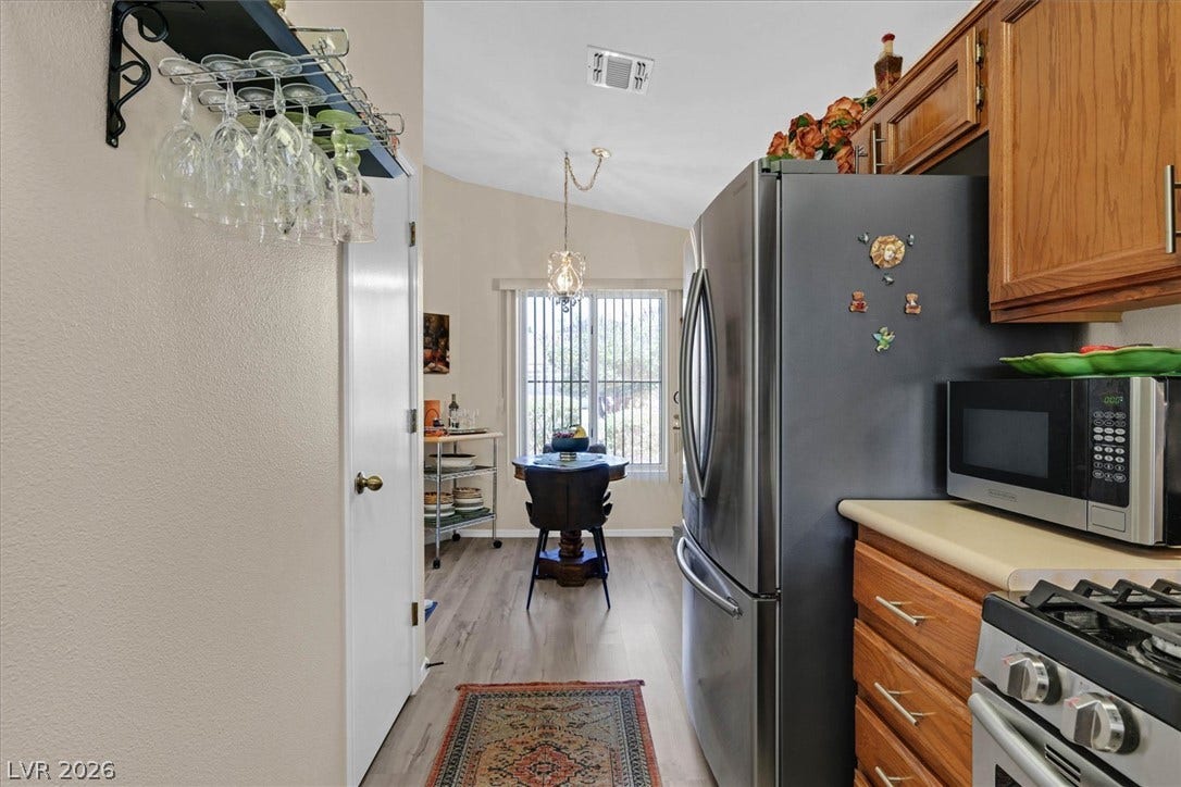 468 Bonnie Brook Place, Henderson, NV 89012 Venture into this kitchen, complete with vaulted ceilings and a charming breakfast nook.