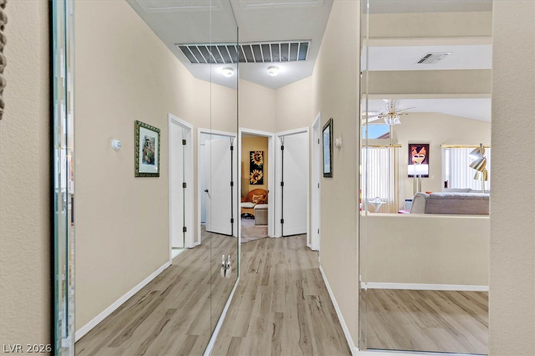 468 Bonnie Brook Place, Henderson, NV 89012 Mirrored walls in the hallway creates an illusion of space.
