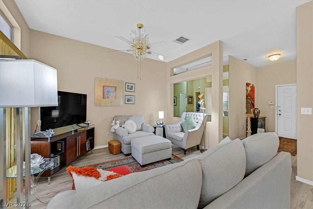 468 Bonnie Brook Place, Henderson, NV 89012 The inviting living space offers abundant natural light and an open-concept flow to the entry.