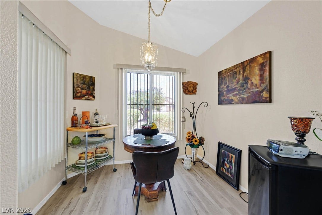 468 Bonnie Brook Place, Henderson, NV 89012 Natural light illuminates this dining area with vaulted ceilings, creating an inviting atmosphere.