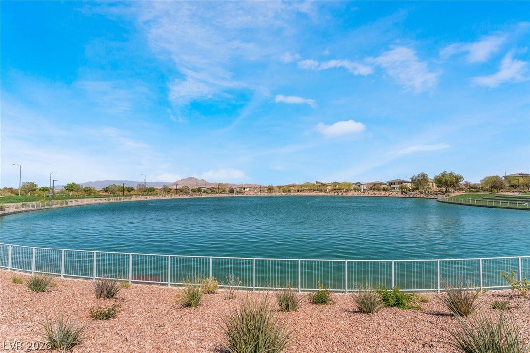 330 Meadow Brush Place, Henderson, NV 89011 Reflecting clear skies, this tranquil lake provides a scenic backdrop for the community.