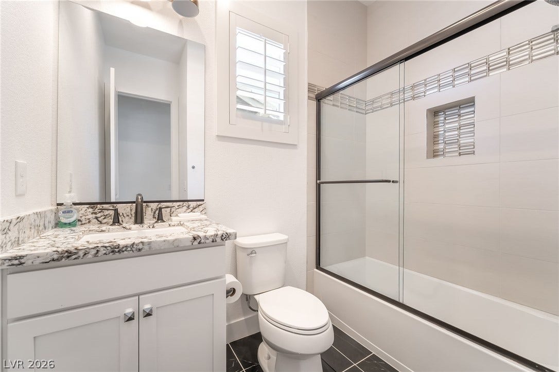 330 Meadow Brush Place, Henderson, NV 89011 Modern full bath with walk-in shower and elegant tile work.