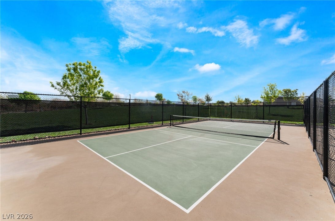 330 Meadow Brush Place, Henderson, NV 89011 An inviting outdoor sports court with ample space for active living, fully fenced.