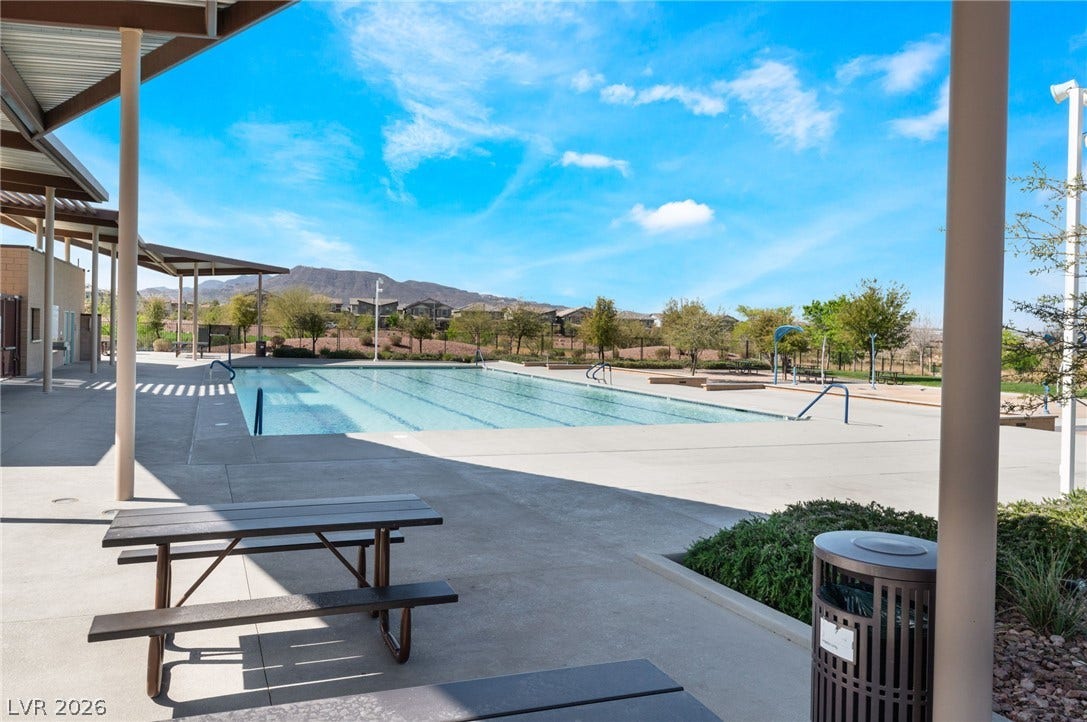 330 Meadow Brush Place, Henderson, NV 89011 Lounge poolside with mountain vistas at this community recreation haven.