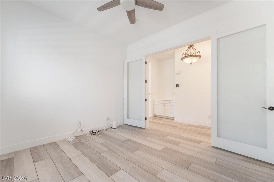 330 Meadow Brush Place, Henderson, NV 89011 Blonde wood flooring and a classic chandelier create an inviting, functional space.