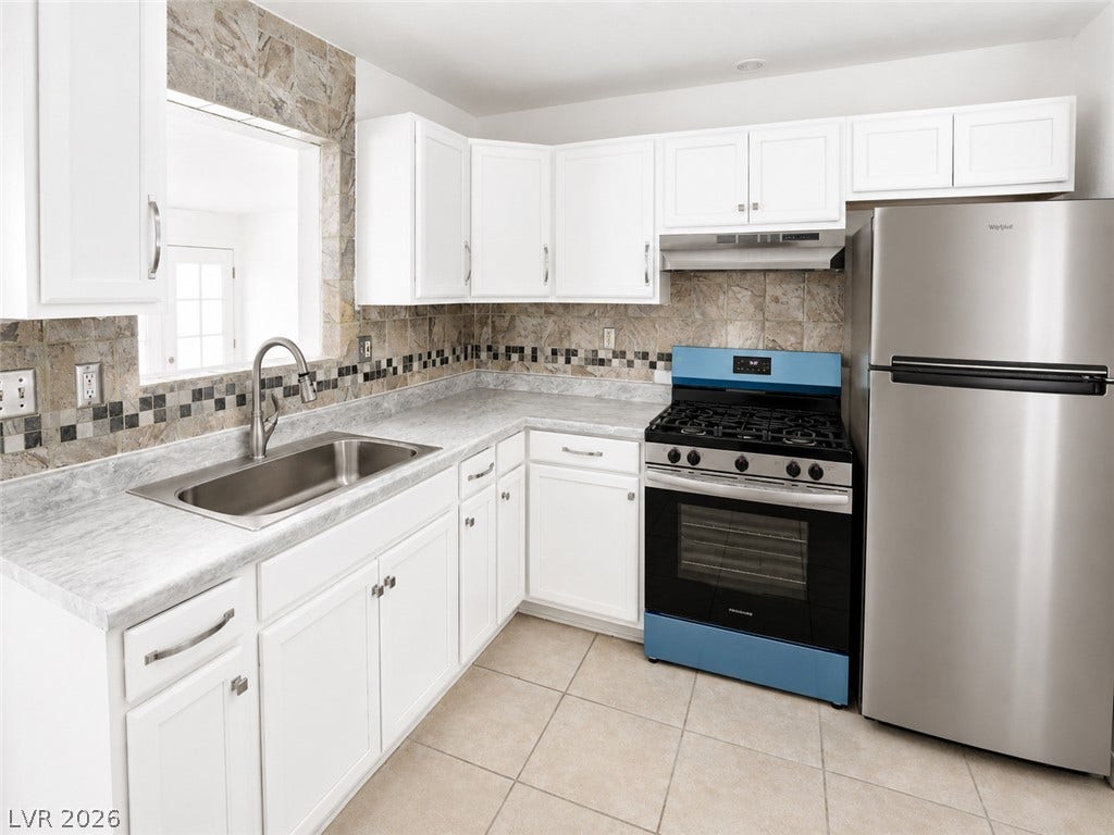 A well-equipped kitchen features modern appliances and a convenient pass-through window.