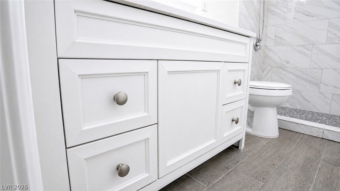Clean lines and a spacious vanity complement this well-appointed bath.