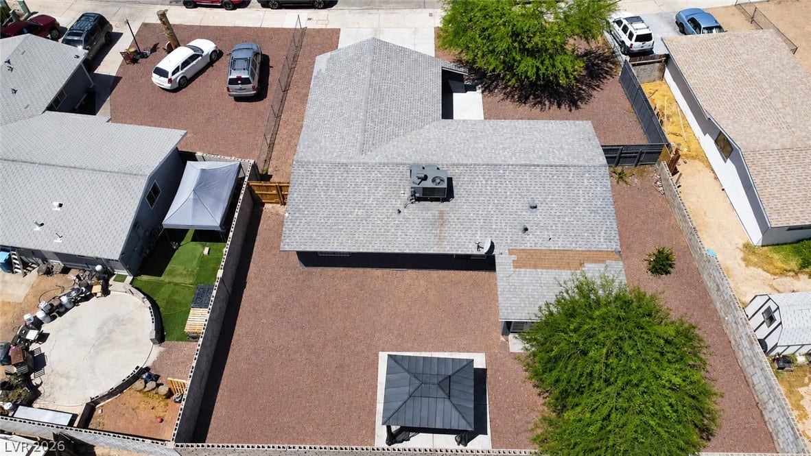 An aerial perspective reveals the property's footprint, showcasing ample outdoor space.