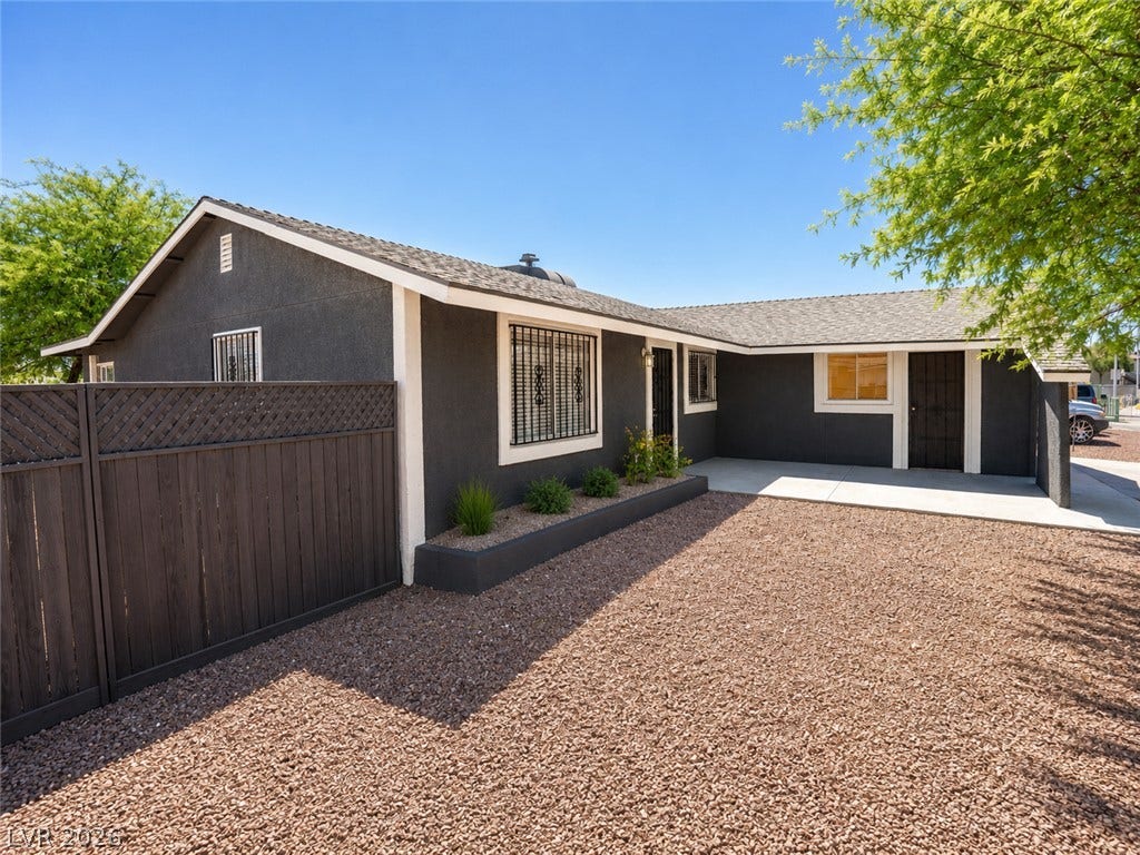 A neatly fenced, low-maintenance front yard welcomes you to this inviting residence.