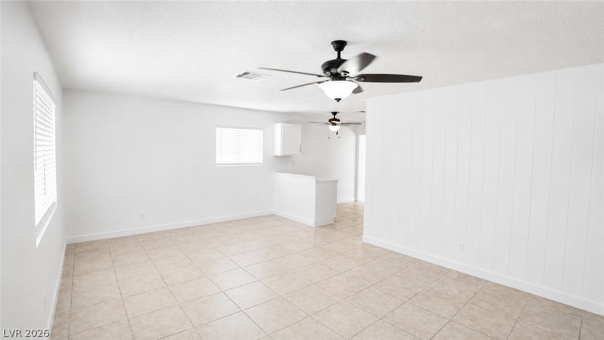 Freshly updated interiors with crisp walls and practical tile flooring.