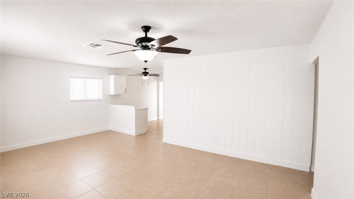 Clean lines define this bright living area, offering a blank canvas for personalization and everyday living.