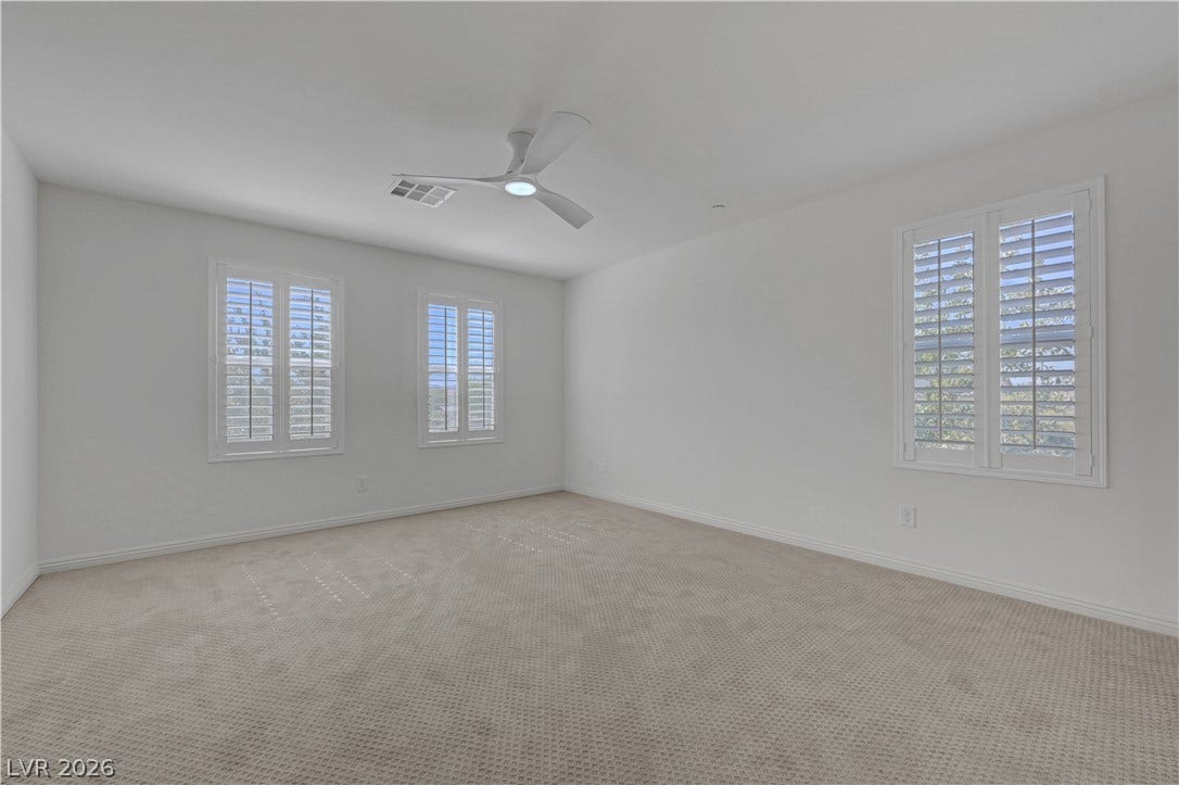Well-lit and tranquil, this carpeted room offers ample natural illumination.