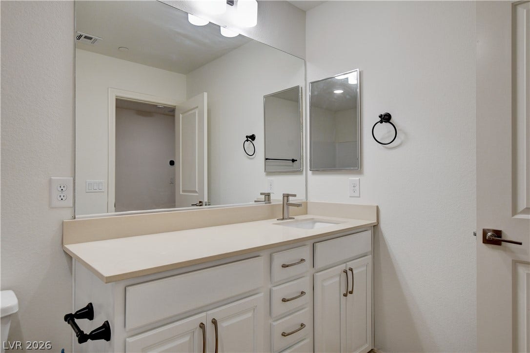 A well-appointed bathroom vanity with ample counter space and modern fixtures awaits.