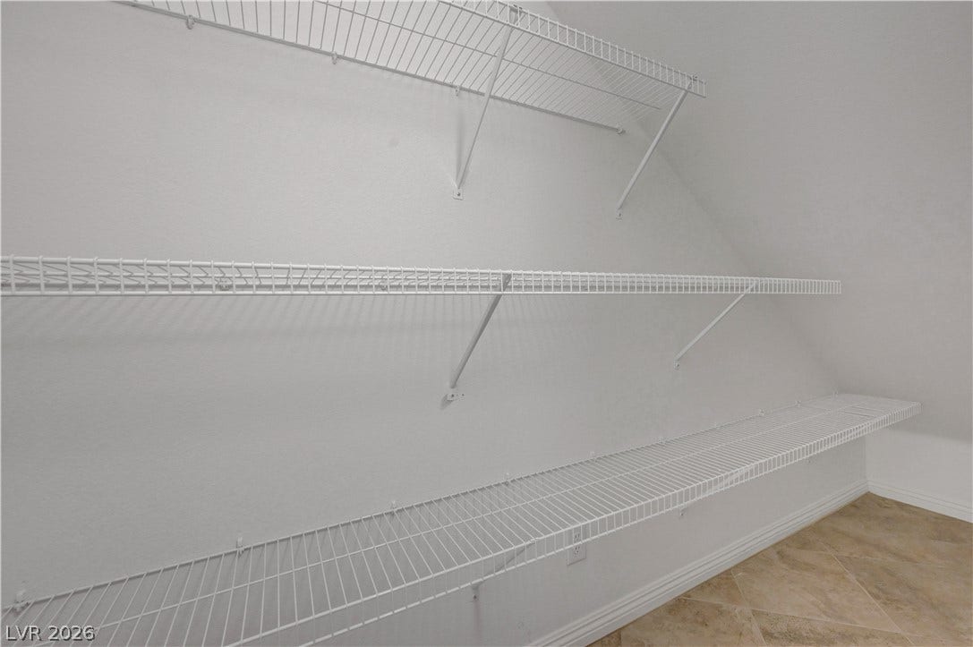 Streamlined wire shelving provides ample storage solutions for an organized living space.