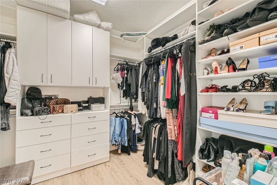 2724 Mintlaw Avenue, Henderson, NV 89044 Ample storage solutions and organizational features define this well-appointed walk-in closet.