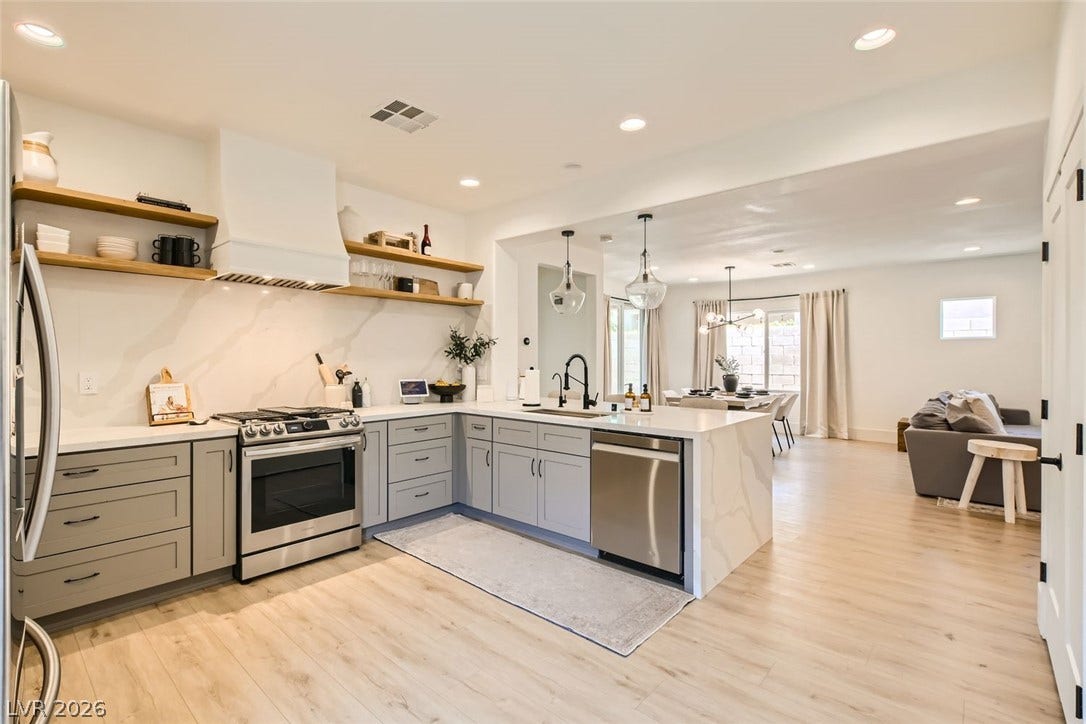 2724 Mintlaw Avenue, Henderson, NV 89044 A streamlined kitchen layout flows into a bright dining space, perfect for entertaining.