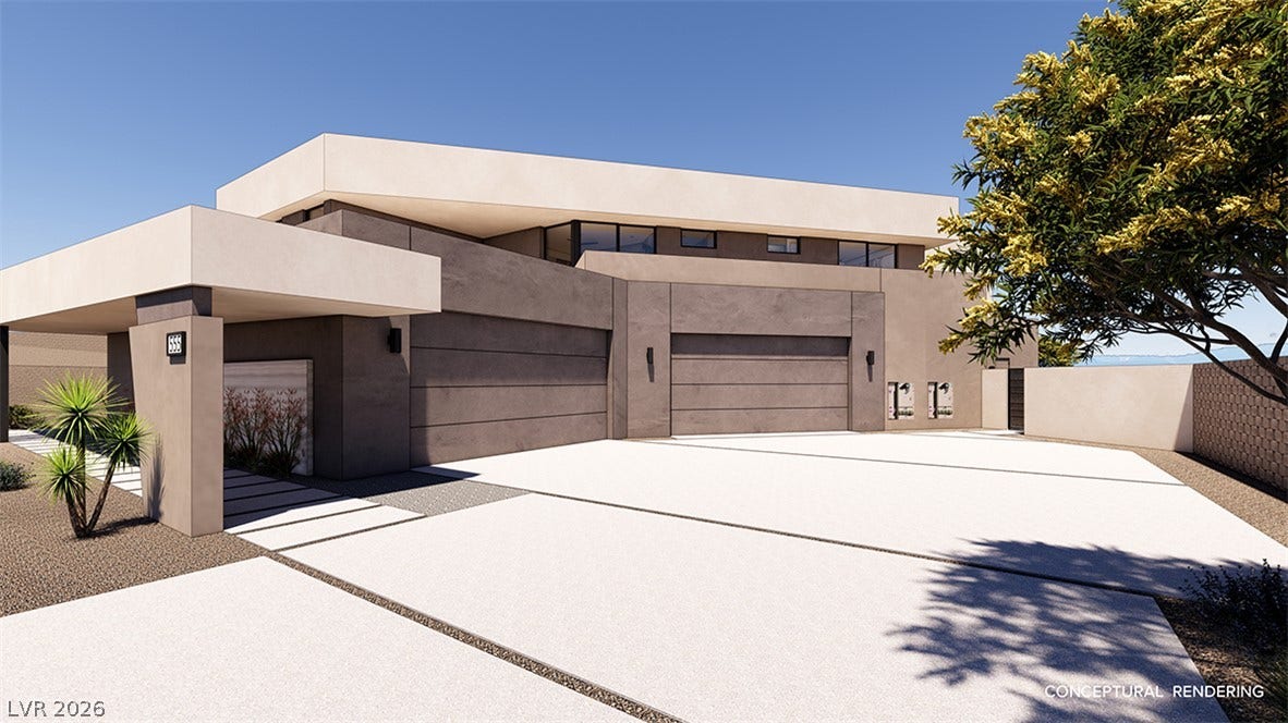 Modern desert architecture with a clean-lined facade and integrated garage entrances.